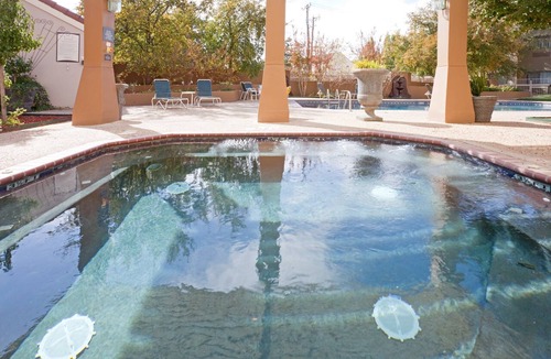 Tech Terrace Condo | King Suite. Shared Pool & Hot Tub. Free Breakfast. Near Texas Tech University & University Medical Center.