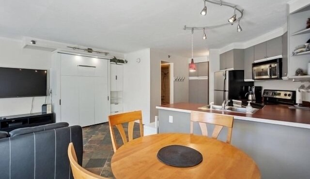 1st floor ski in & out resort condo with hot tubs, fitness room, covered garage.