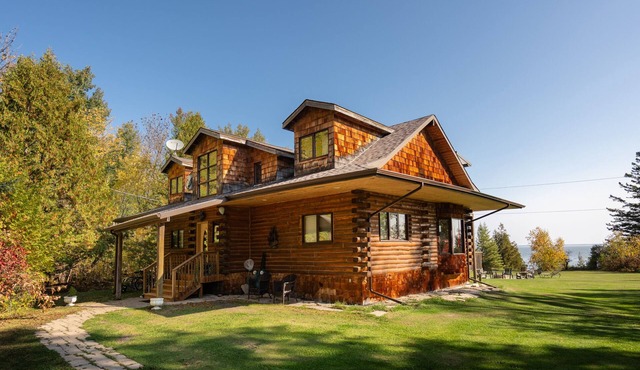 Authentic & Stunning, Rustic Log House located on 28 acres with private road in Traverse Bay