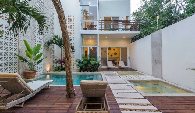 Experience tropical luxury in our villa with pools, lush surroundings, and concierge in Aldea Zama in Tulum