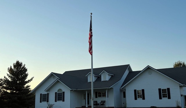 Fully custom modern four bedroom home on 13 acres with a stocked pond. in Murphysboro