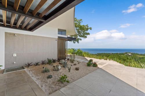 Luxurious Ultramodern Property with Private Suites, Infinity Pool, and Sweeping Ocean and Mountain Views in Potrero
