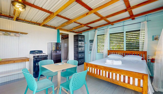 Rustic beachfront cabin with private deck, ocean views & family-friendly vibe in Placencia