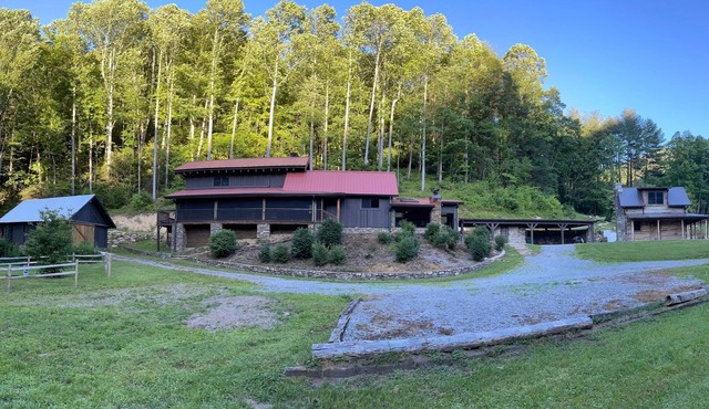 Secluded luxury cabins with water views, game table, wood stove & outdoor dining in Canton