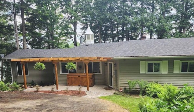 Spacious, waterfront home surrounded by trees with large dock & games room. in Haliburton