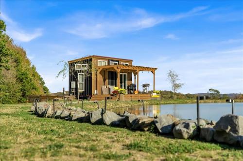 Tiny House On a Tiny Lake Porch at Waters Edge in Brackney