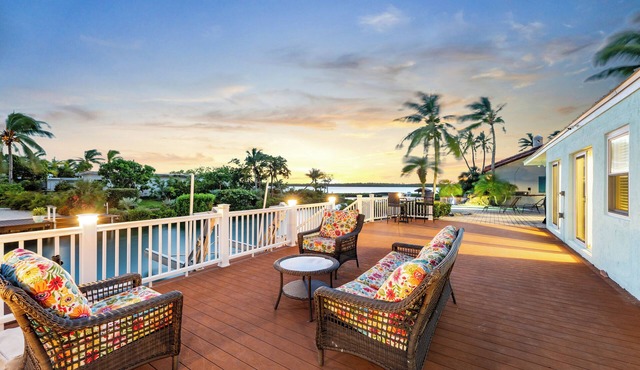 Waterfront home with a large dock, pool, and deck area. Can accommodate pets.