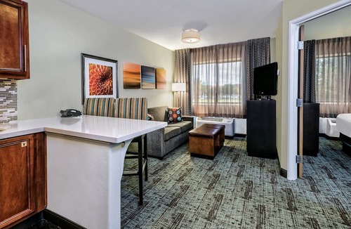 Tech Terrace Condo | King Suite. Shared Pool & Hot Tub. Free Breakfast. Near Texas Tech University & University Medical Center.