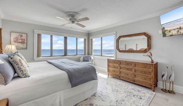 Direct oceanfront corner 3/2 with a large wrap around balcony and heated pool
